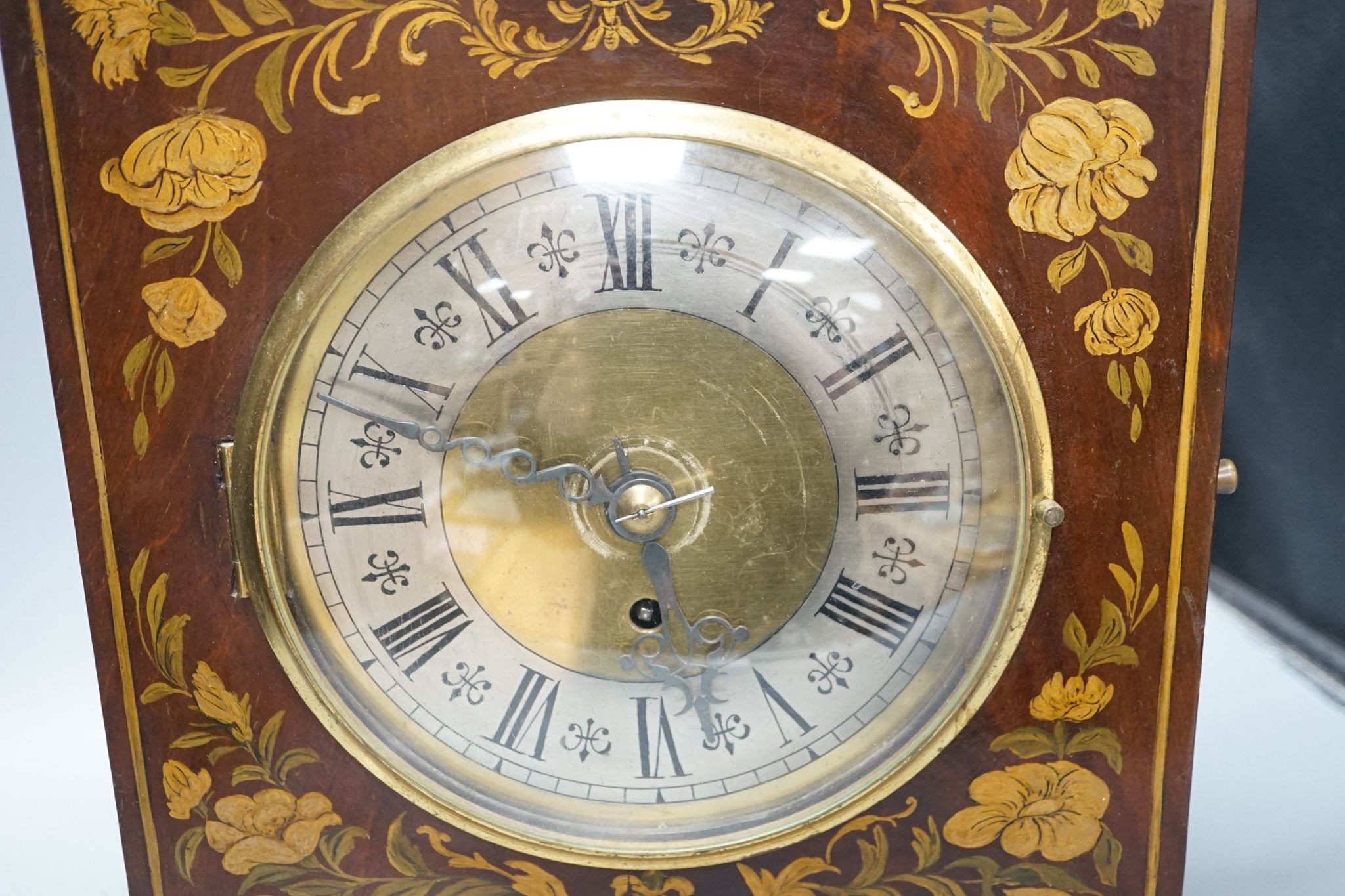 A Victorian floral painted mahogany bracket timepiece, with fusee movement, with key and pendulum, 49cm